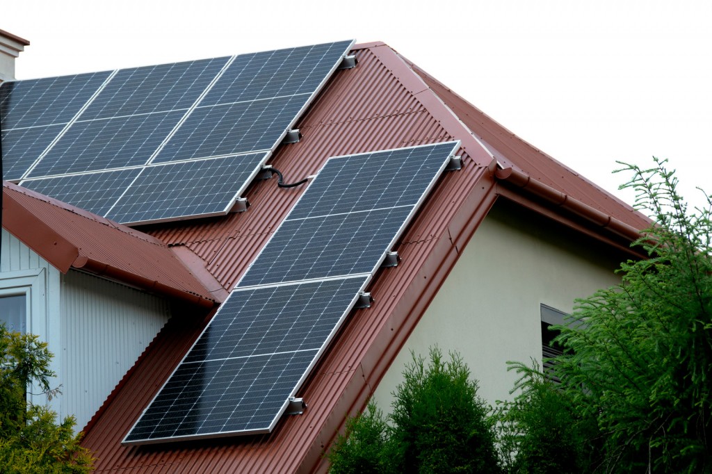 canva-installing-a-solar-cell-on-a-roof.-solar-panels-on-roof.-historic-farm-house-with-modern-solar-panels-on-roof-and-wall.-high-quality-photo-MAFlziqnM2s